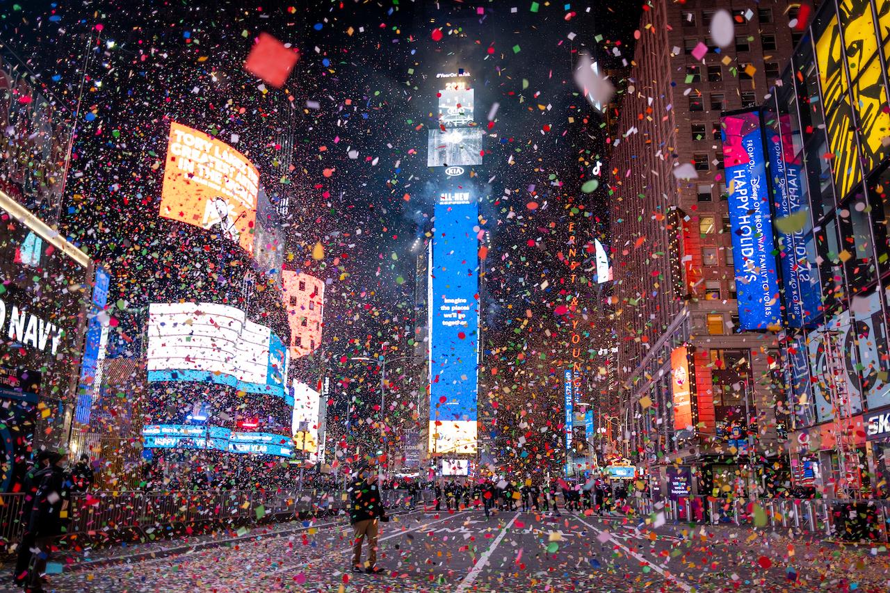 Confetti flies after the Times Square New Year's Eve Ball drops in a nearly empty Times Square, early Jan 1, as the area normally packed with revellers remained closed off due to the ongoing coronavirus pandemic. Photo: AP