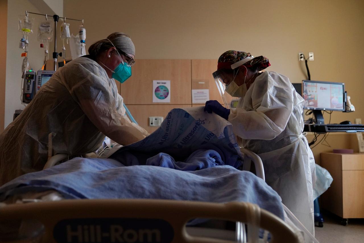 Nurses treat a Covid-19 patient at a hospital in Los Angeles, California. Photo: AP