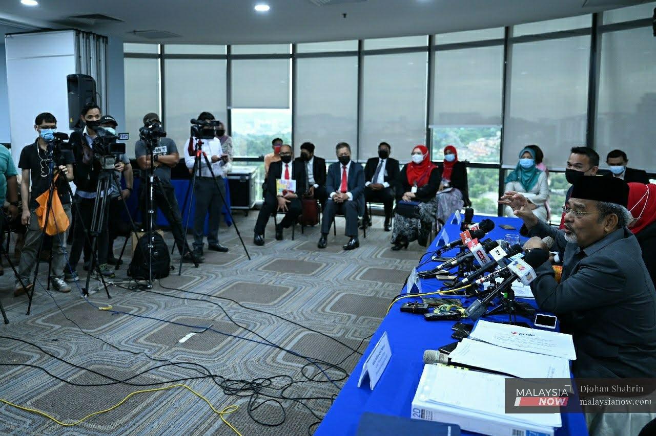 Umno election director Tajuddin Abdul Rahman speaks at a press conference today.