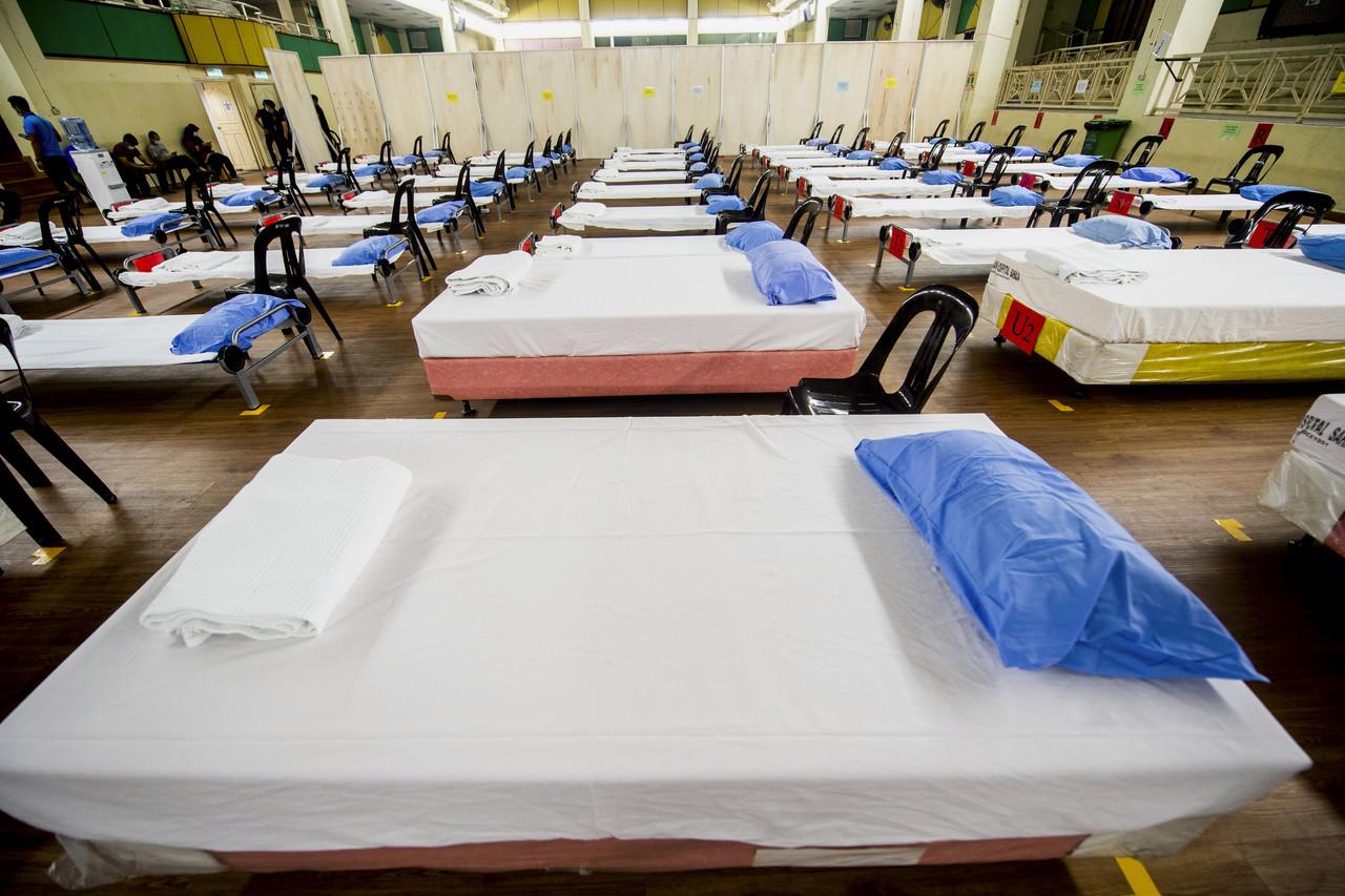 Beds are arranged at the low-risk quarantine centre at Dewan Jubli Perak in Kota Bharu. Photo: Bernama