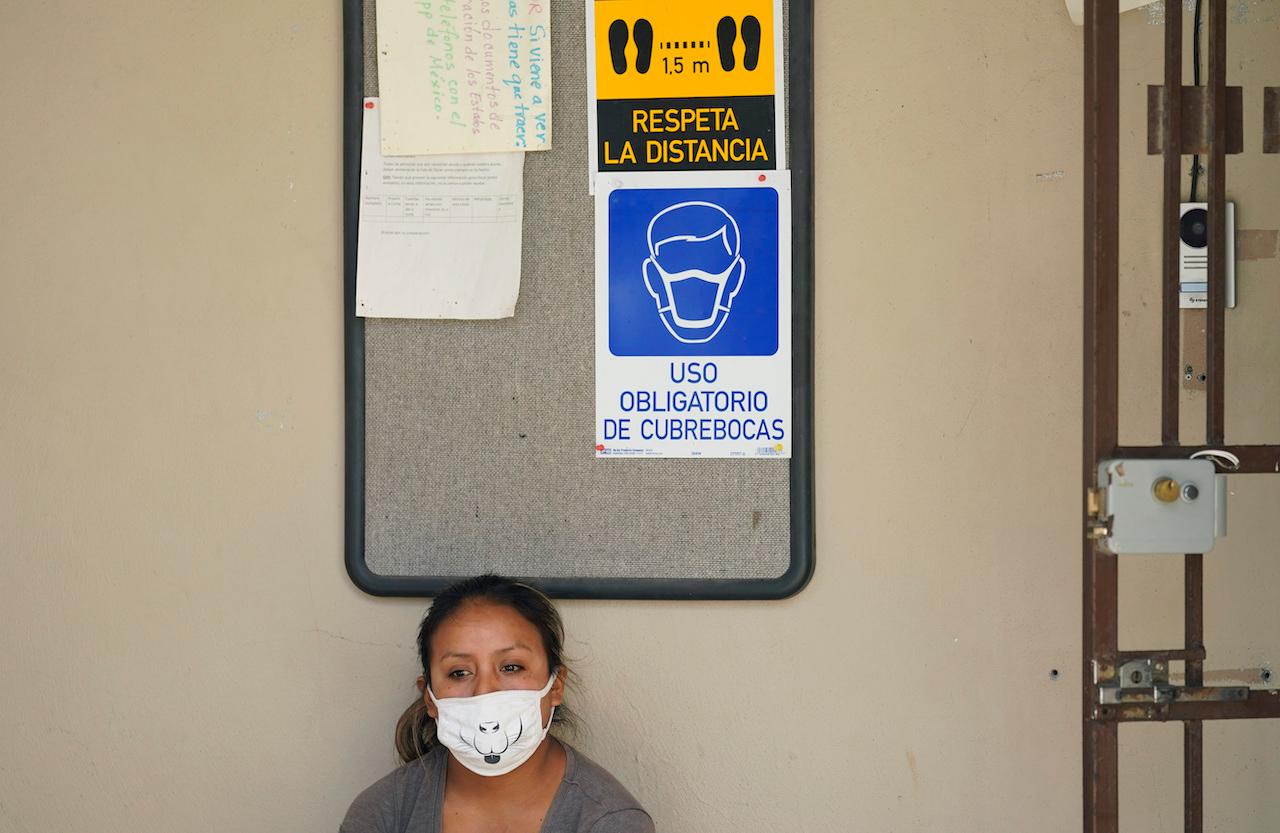 A woman seeking asylum in the US and living at a camp in Matamoros, Mexico, waits for her Covid-19 antibody test results at a clinic, Nov 17, 2020. President Andres Manuel Lopez Obrador has said he is ready to provide coronavirus vaccines to undocumented migrants in the US. Photo: AP