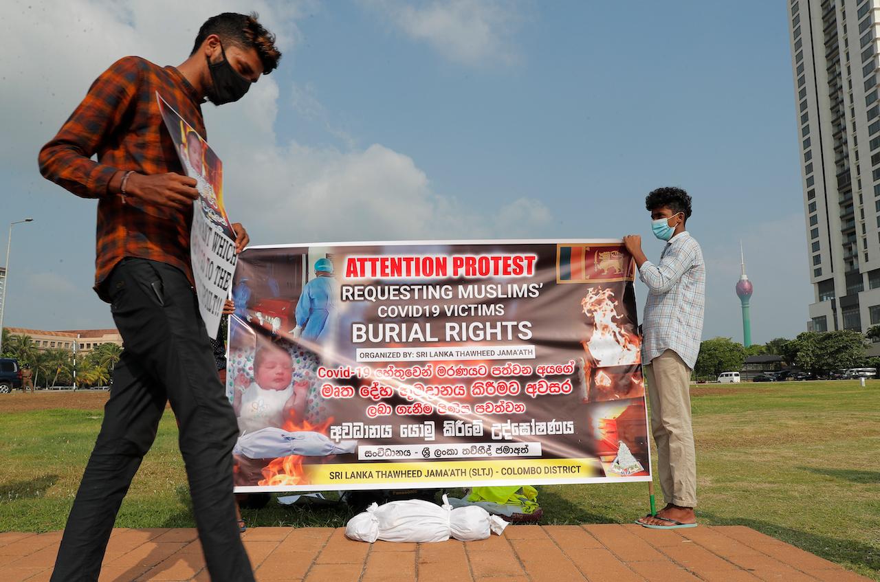Members of a Muslim organisation in Sri Lanka display a banner demanding burial rights for Muslims who die of Covid-19 in Colombo, Sri Lanka, Dec 16, 2020. Photo: AP