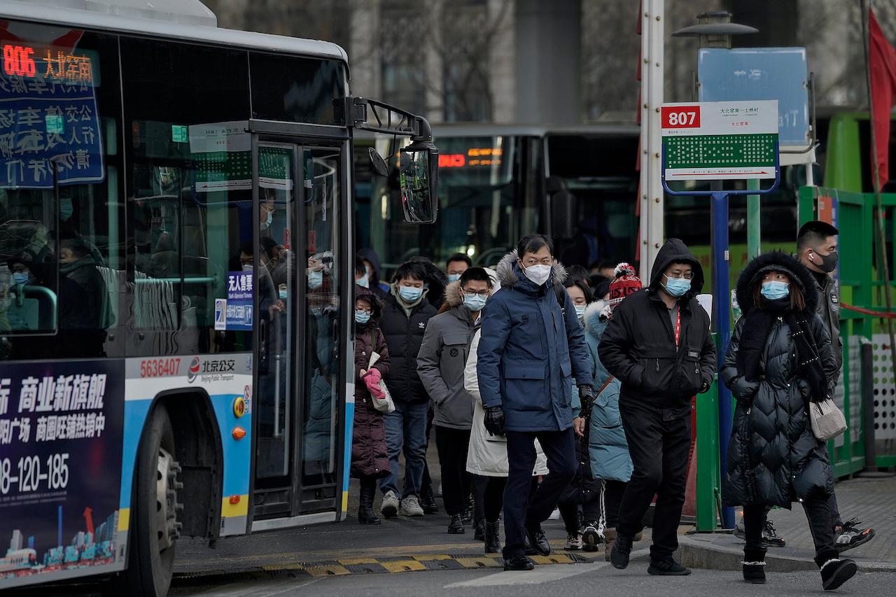 China will open its borders for WHO experts to enter and form a joint research operation to investigate the virus origins. Photo: AP