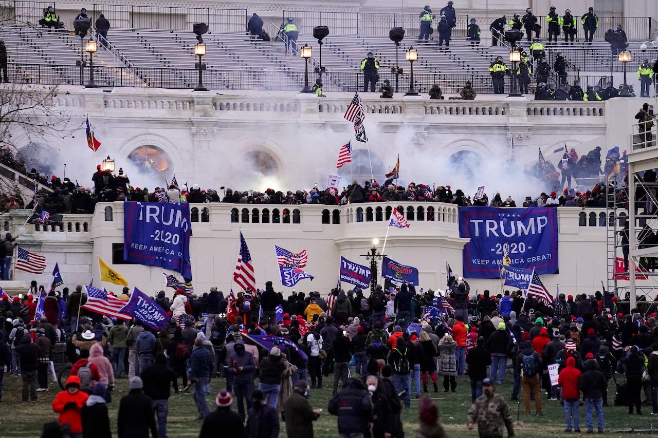 Pro-Trump protesters storm the Capitol in Washington, Jan 6. Photo: AP