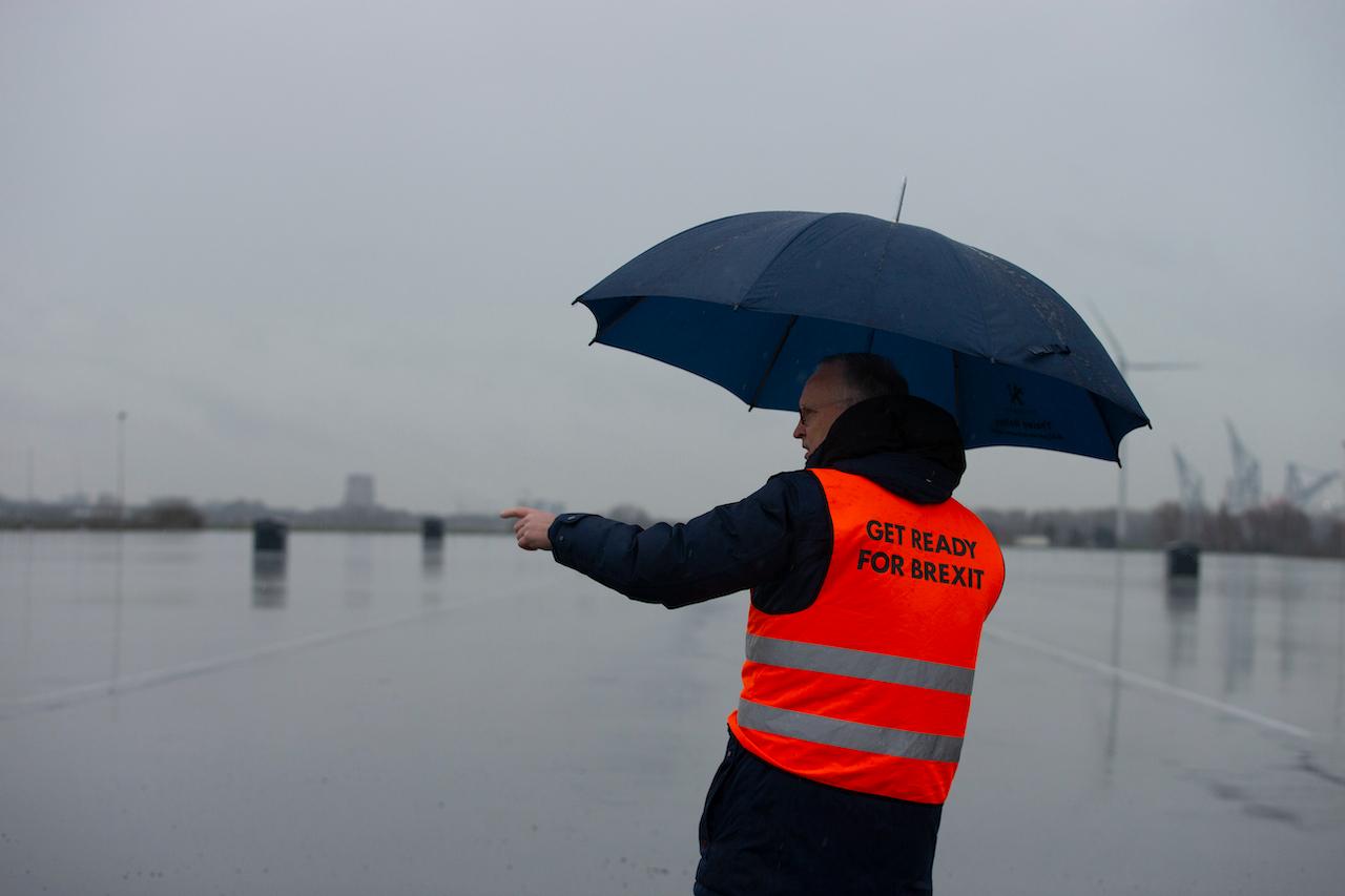 A spokesman wears a safety vest during a press tour of an overflow parking lot for trucks after the Brexit transition period, in Hook of Holland, near Rotterdam, Netherlands, Dec 21, 2020. Photo: AP