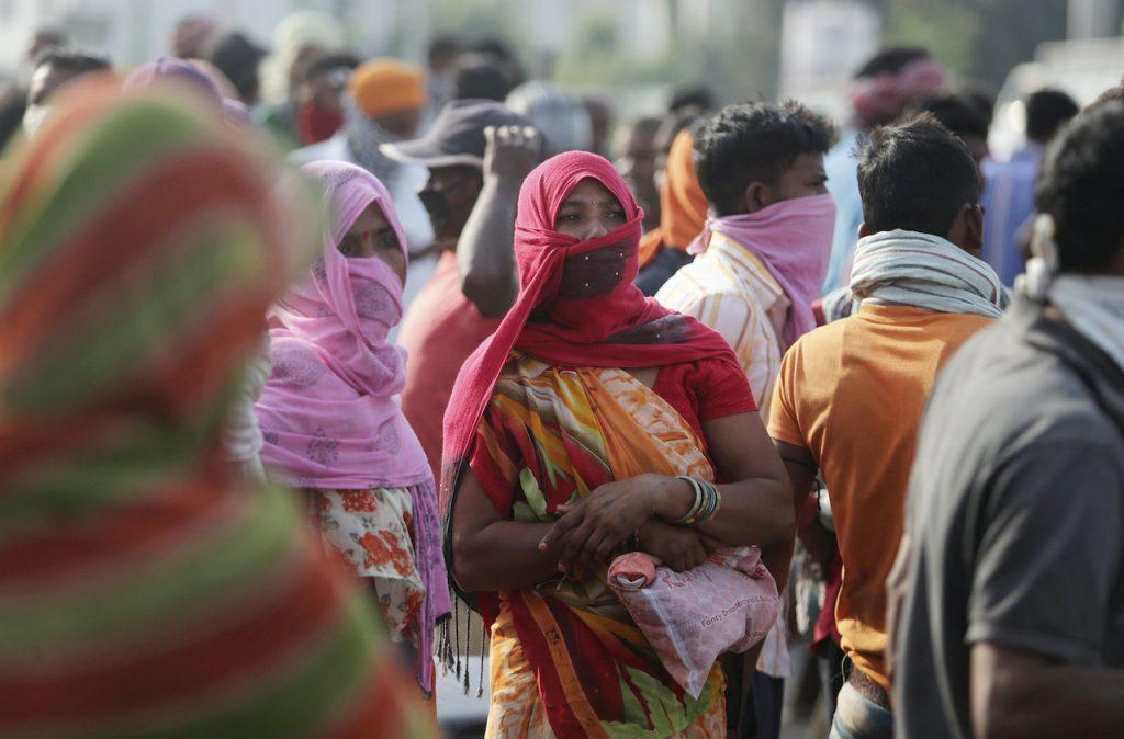 Women walk through the city in Jammu, India on Sept 27, 2020. Madhya Pradesh authorities are heading a fortnight-long public awareness drive about crime against women across the state. Photo: AP