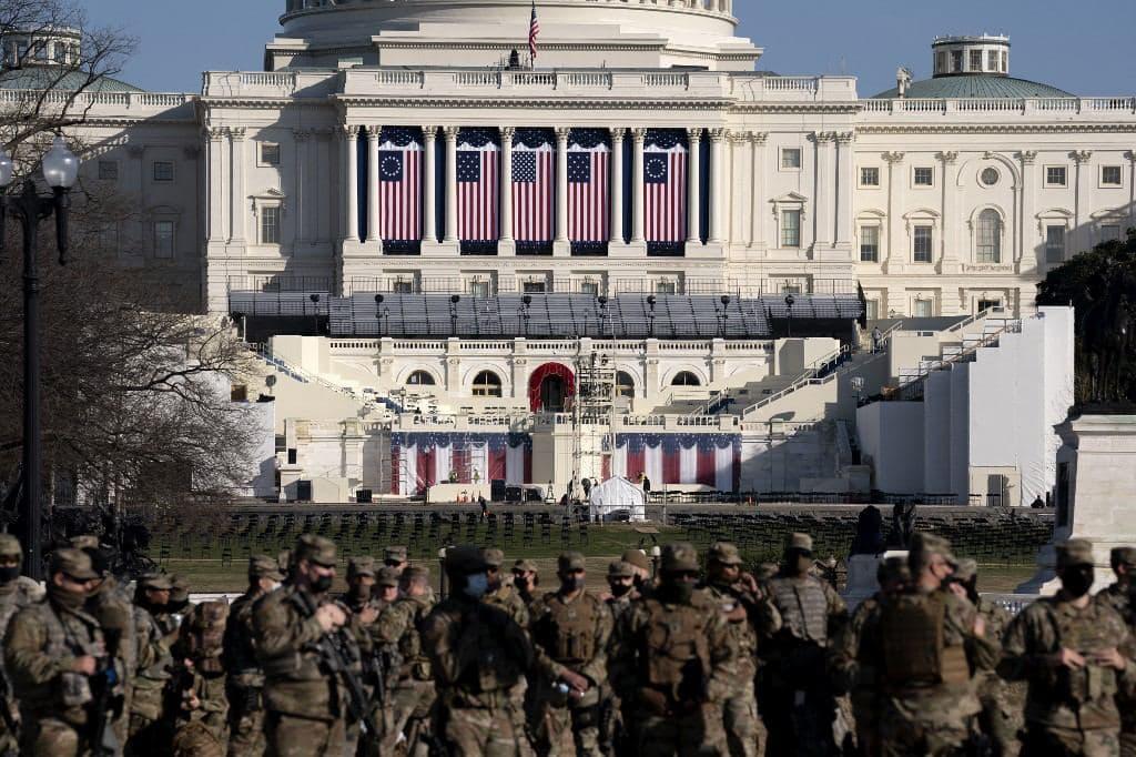 Members of the National Guard patrol the perimeter of the Capitol building in Washington DC, Jan 15. Photo: AFP