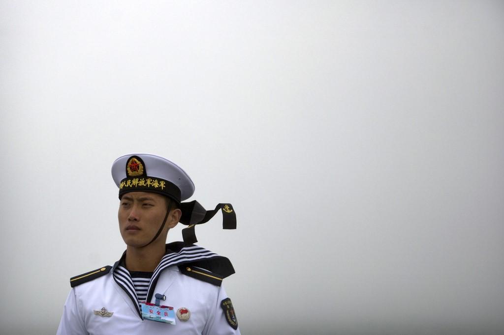 A Chinese sailor stands guard on the deck of a naval training ship in this picture taken April 23, 2019. Photo: AP