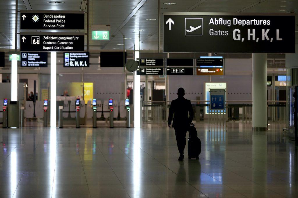 An airline staff member arrives at the security check at the deserted airport in Munich, Germany, Nov 12. Some EU countries, such as Germany, have imposed tougher restrictions in a bid to control infections. Photo: AP