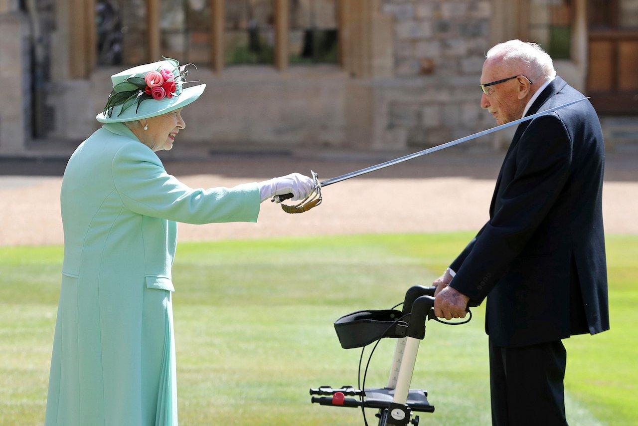 Captain Sir Thomas Moore receives his knighthood from Britain's Queen Elizabeth, during a ceremony at Windsor Castle in Windsor, England, July 17, 2020. Photo: AP