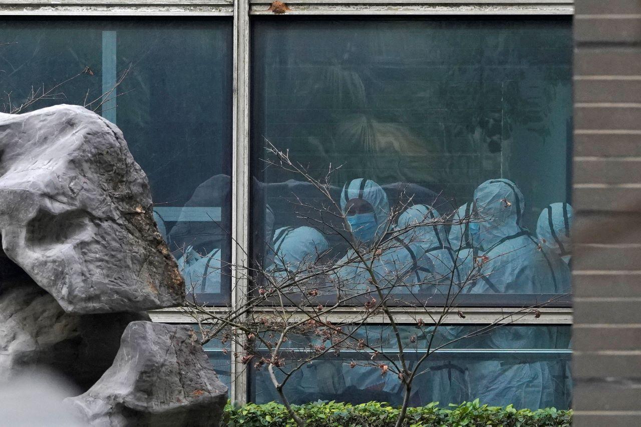 Members of a World Health Organization team wear protective gear during a field visit to the Hubei Animal Disease Control and Prevention Center, Feb 2. The WHO team investigating the origins of the coronavirus pandemic has visited two disease control centres in the province. Photo: AP