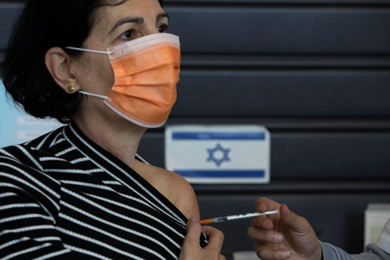 An Israeli woman receives a Pfizer-BioNTech coronavirus vaccine at a vaccination center in Tel Aviv, Israel, Feb 2. Photo: AP