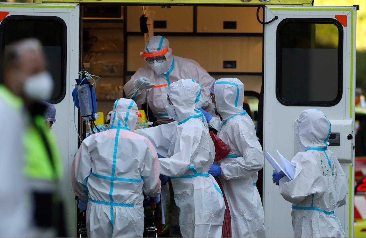 Healthcare workers move a Covid-19 patient to a hospital in Prague, Czech Republic, in this file photo dated Nov 6, 2020. Photo: AP