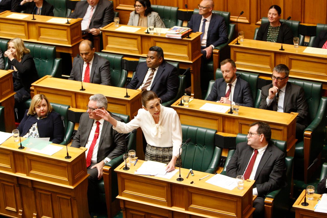 New Zealand Prime Minister Jacinda Ardern speaks in Parliament in Wellington, Dec 2, 2020. Male MPs can only ask questions in the debating chamber if they are wearing a tie as part of formal business attire, Photo: AP