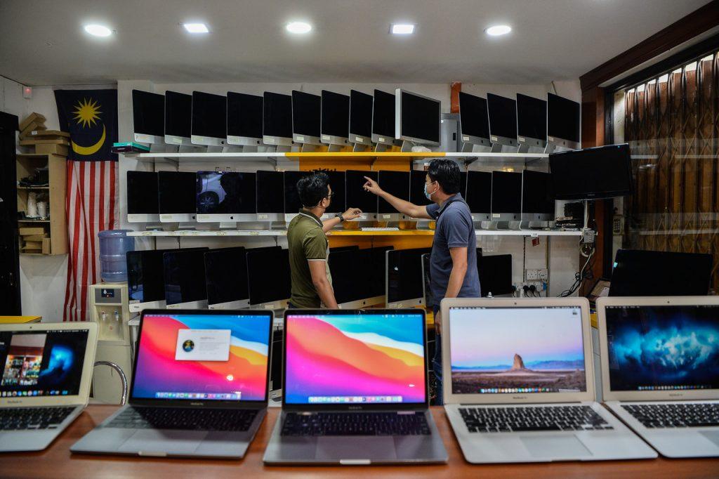 Laptops and tablet computers have been in high demand due to the implementation of home-based learning under the movement control order. Photo: Bernama