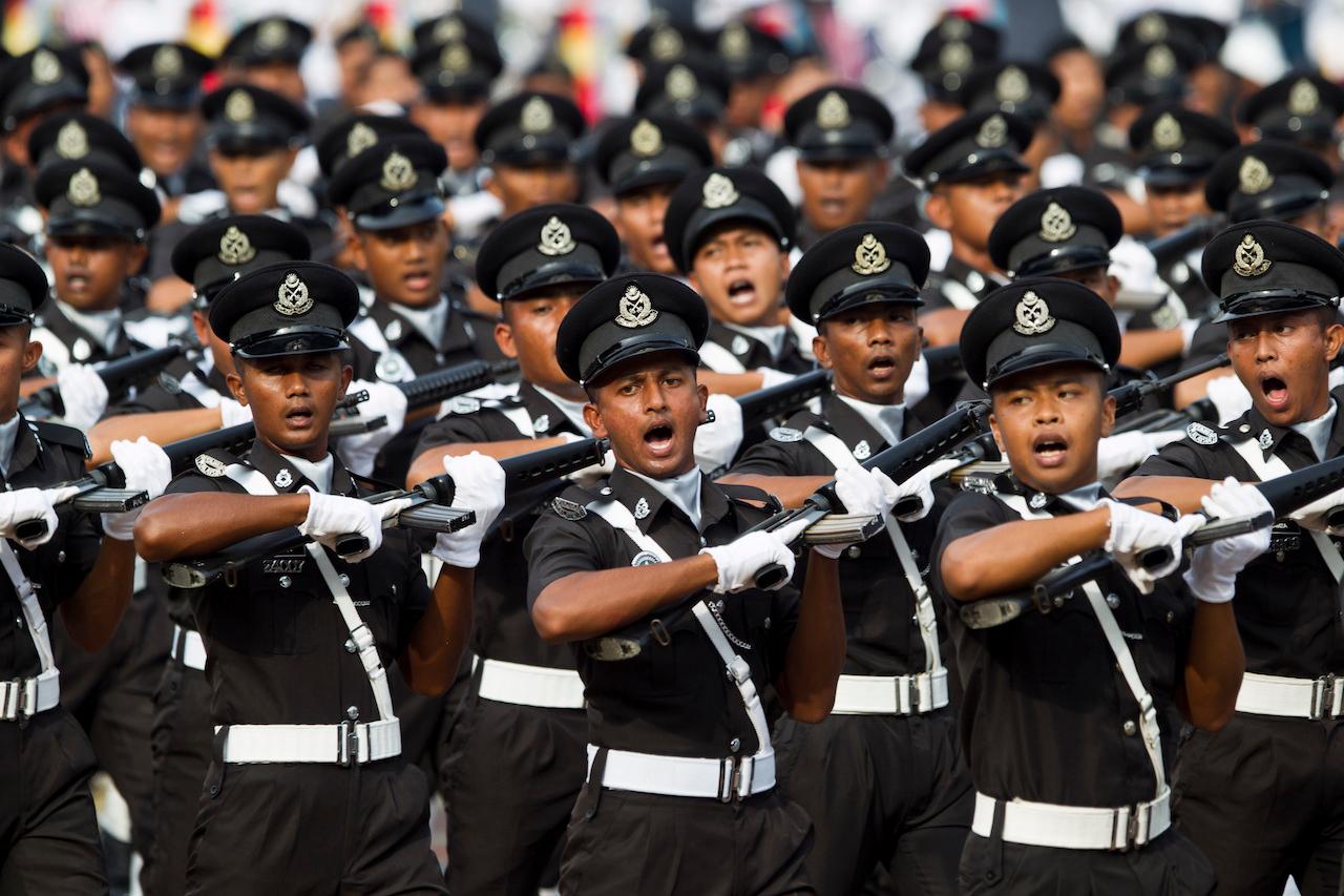 Members of the police force march during a parade for Merdeka Day in this Aug 31, 2018 file photo. The Independent Police Conduct Commission (IPCC) Bill will see the formation of an independent oversight body to improve integrity within the force and boost public confidence in the police. Photo: AP