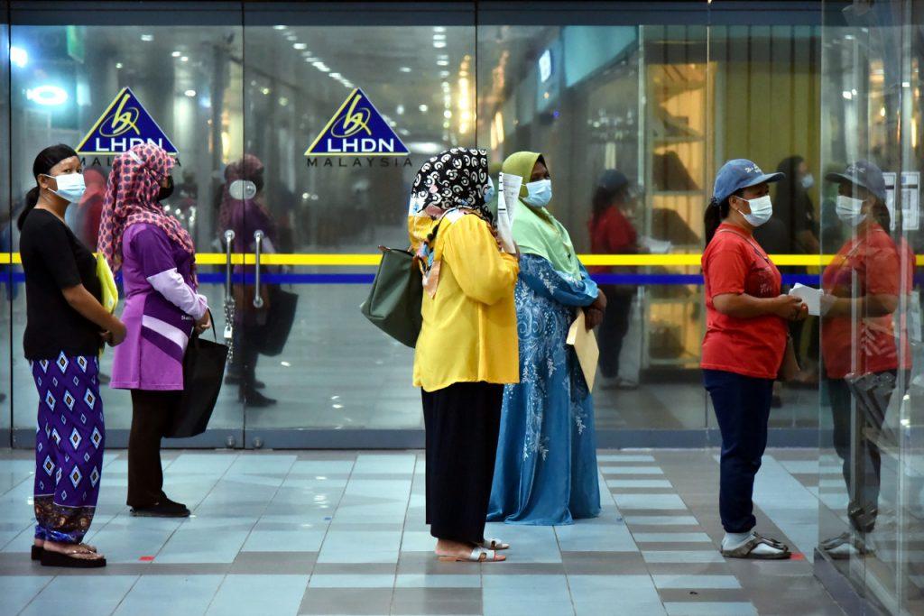 The Inland Revenue Board is urging the public to keep a watchful eye for scammers, and to call its hotline or visit the nearest branch if they have any suspicions. Photo: Bernama