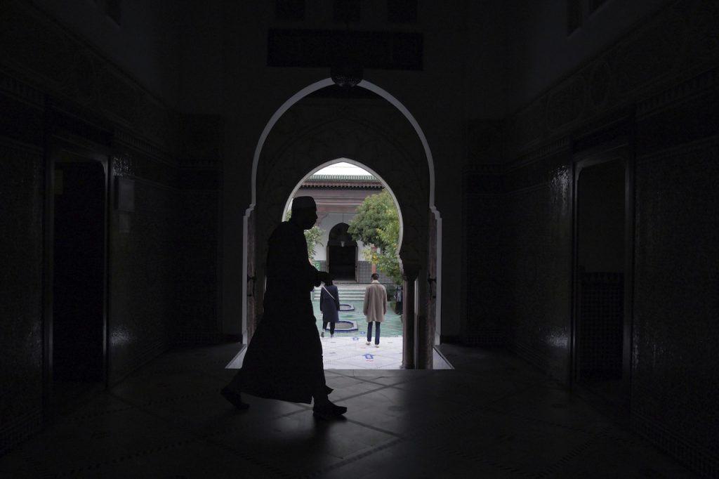 A man walks in a mosque in Paris, France. The text of a new law to battle 'Islamic separatism' will now be submitted to the upper house Senate after being passed by the lower house on Feb 16. Photo: AP