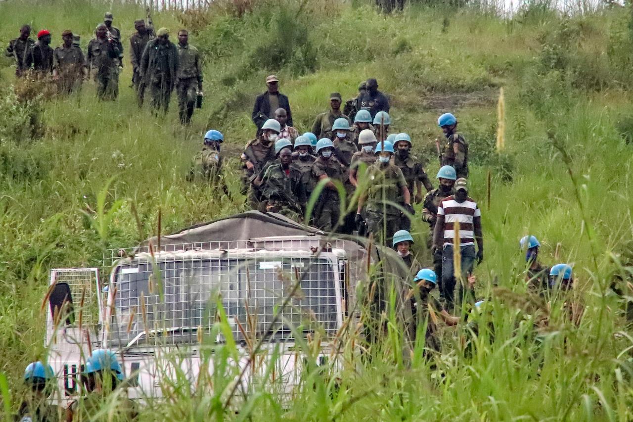 United Nations peacekeepers remove bodies from an area near to where a UN convoy was attacked and the Italian ambassador to Congo killed, in Nyiragongo, North Kivu province, Congo, Feb 22. Photo: AP