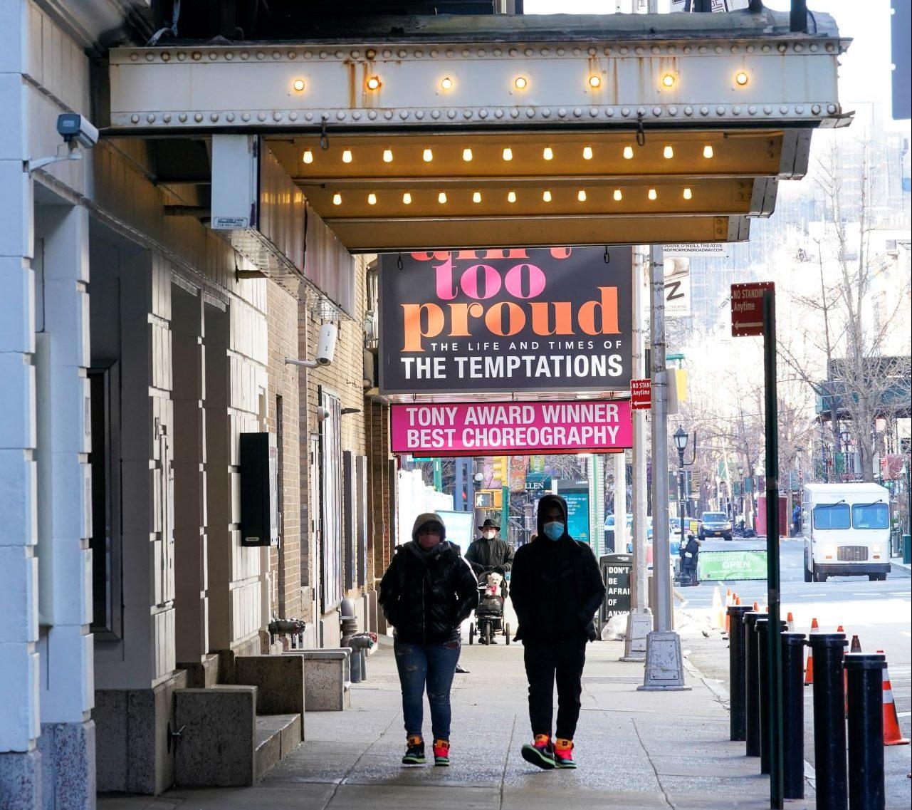 Pedestrians walk past closed theatres in the Hell's Kitchen neighbourhood of New York, Jan 10. Photo: AP
