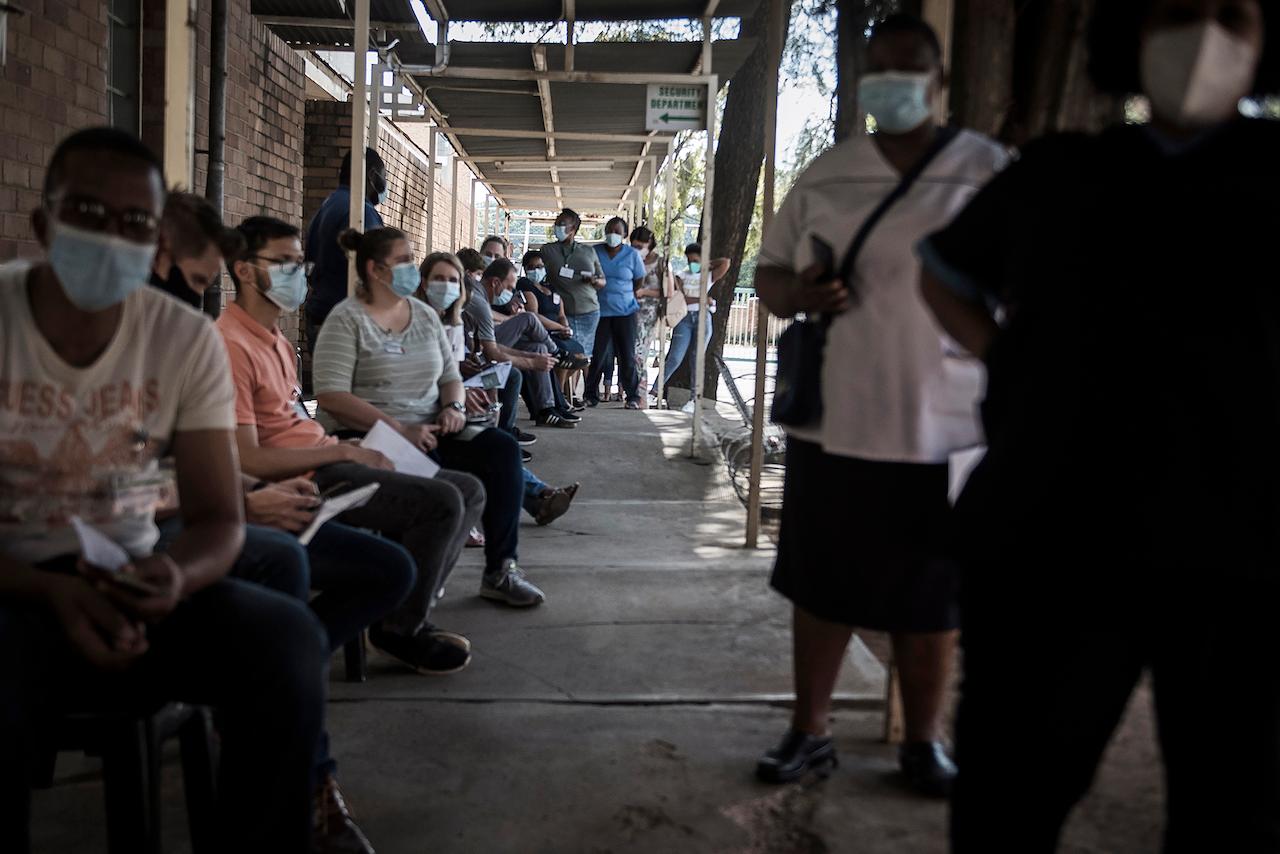 Healthcare workers queue to receive the Johnson & Johnson vaccine at the government hospital in Klerksdorp, South Africa, Feb 18. The Johnson & Johnson vaccine only requires one dose and can be stored at fridge temperature rather than in freezers like the Pfizer and Moderna shots. Photo: AP