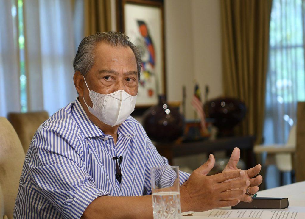Prime Minister Muhyiddin Yassin speaks in an interview on the eve of his first year in the top office. Photo: Bernama