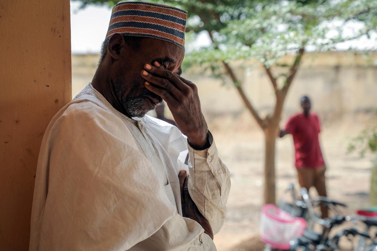 Father Aliyu Ladan Jangebe, whose four daughters are among more than 300 girls who were abducted by gunmen on Friday from the Government Girls Junior Secondary School, waits for news in Jangebe town, Zamfara state, northern Nigeria, Feb 28. Photo: AP