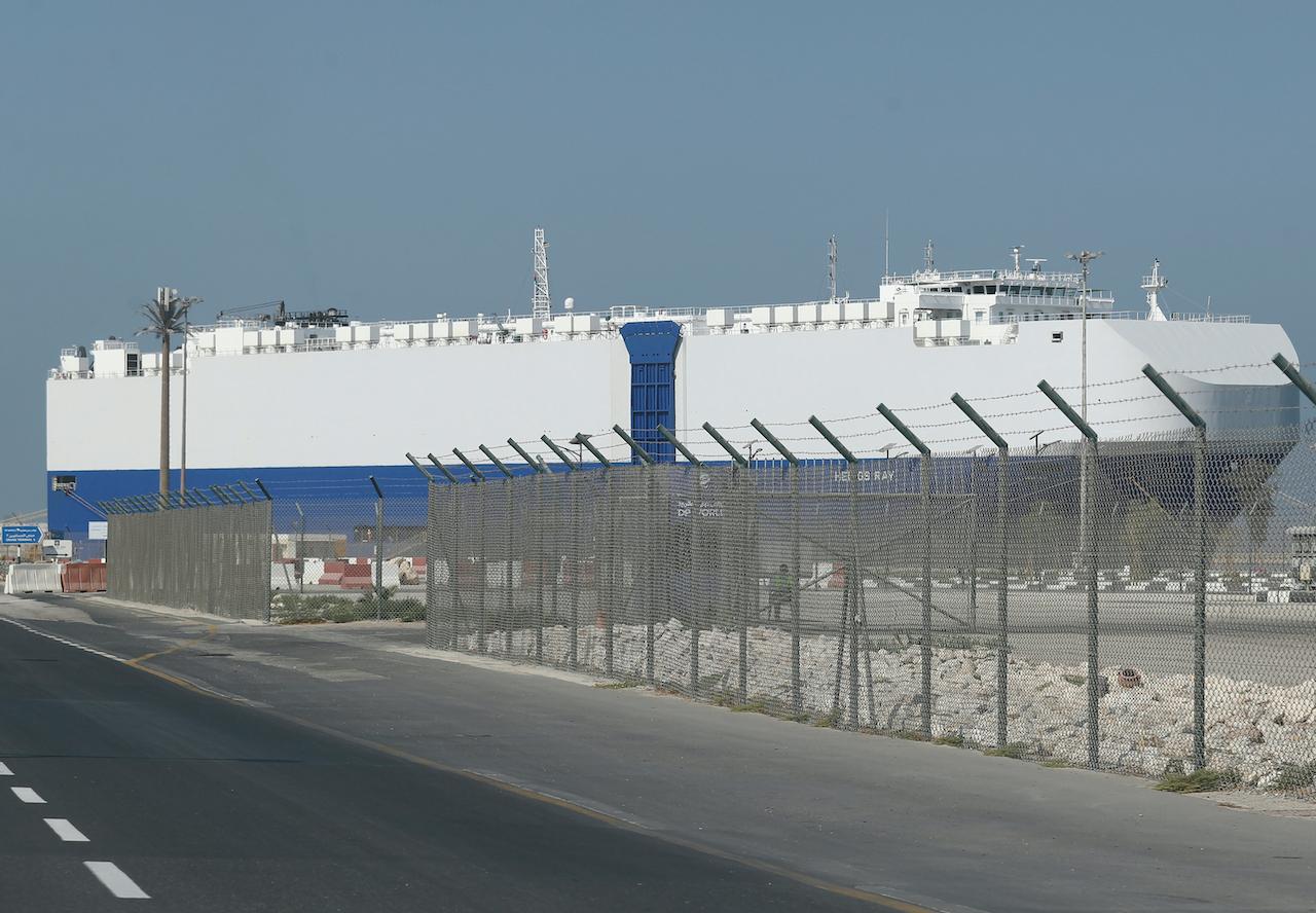 Helios Ray, an Israeli-owned cargo ship, docked at a port after arriving at Dubai on Feb 28. The ship was damaged by an unexplained blast at the gulf of Oman last week. Photo: AP
