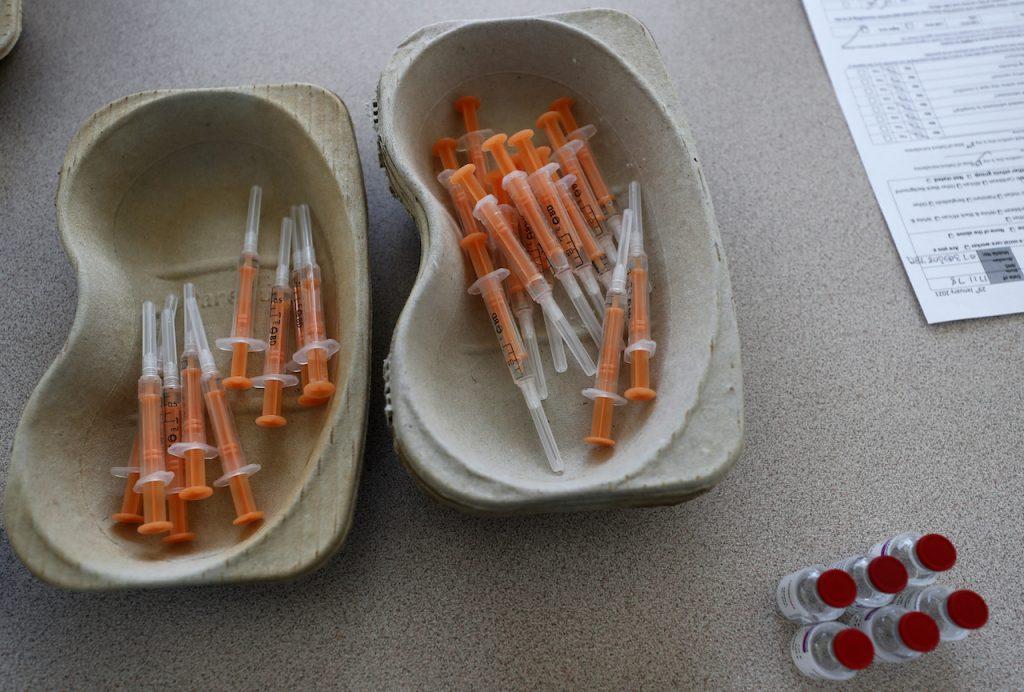 In this Feb 5, 2021 file photo, vials of the AstraZeneca vaccine and loaded syringes wait to be administered in Ilford, east London. Photo: AP