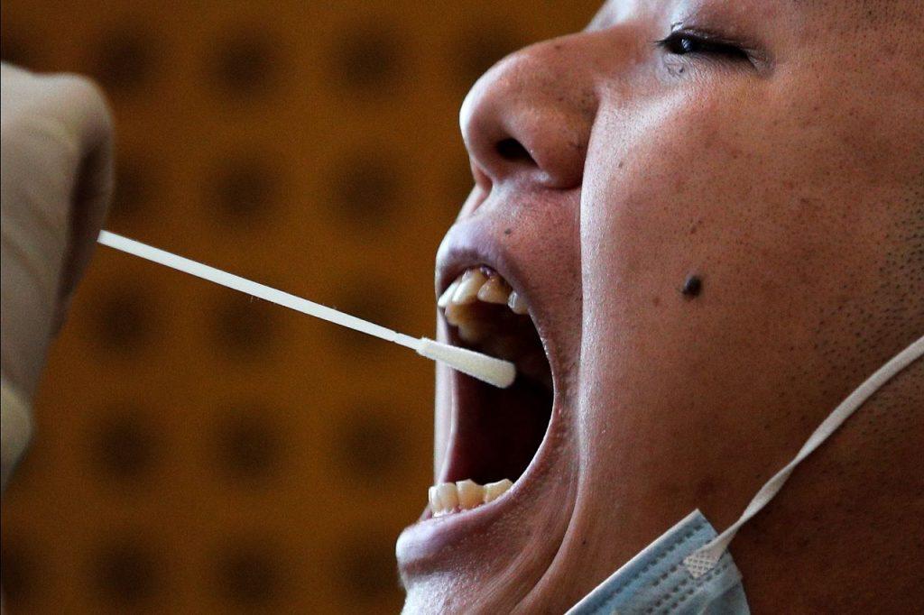China said last month that anal swabs can be more effective than normal throat and nose tests as the virus can linger longer in the digestive system. Photo: AP