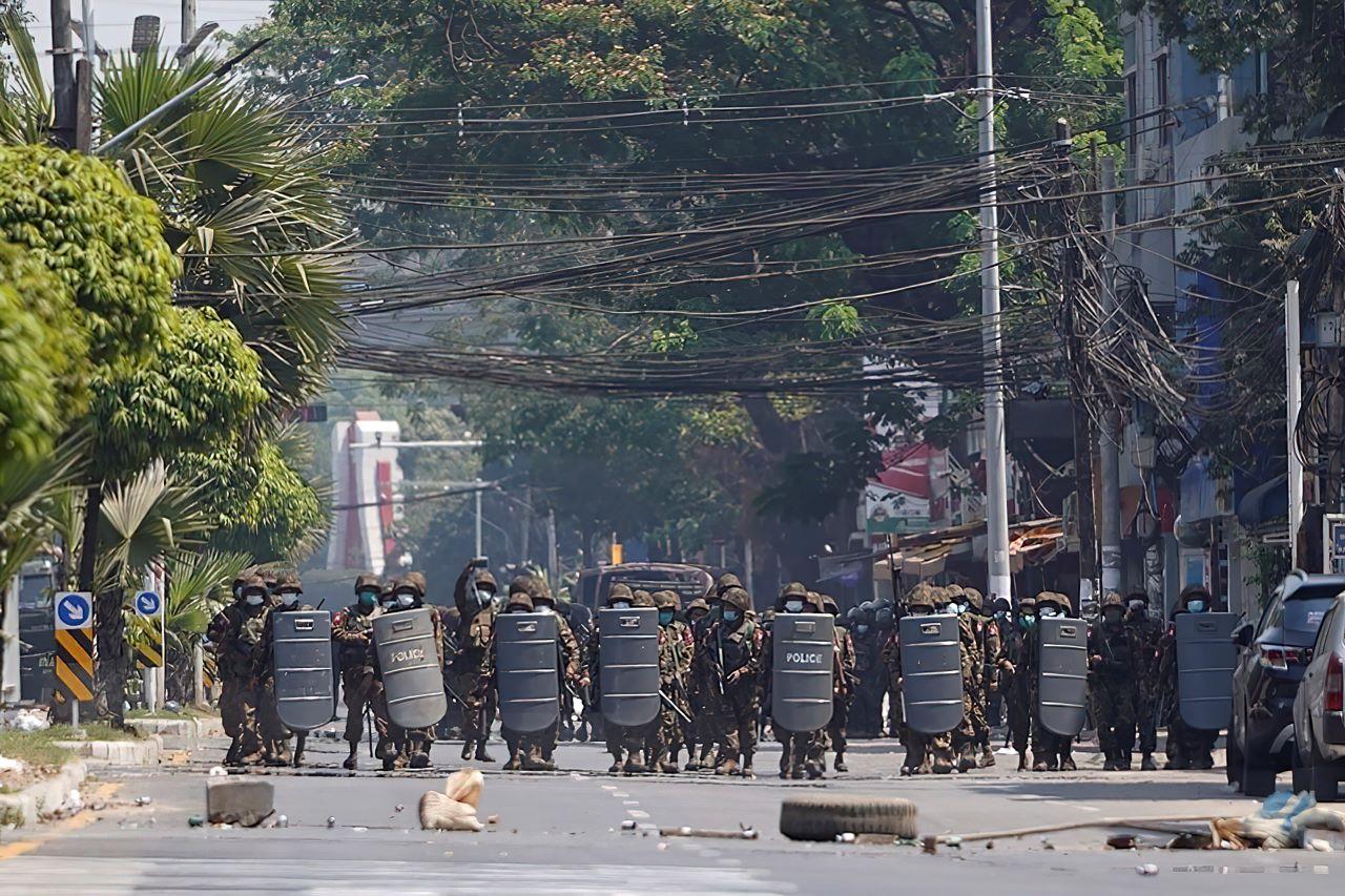 Myanmar military with shields move forward during a protest against the military coup in Yangon, Myanmar, March 2. Authorities have steadily stepped up their use of force against protesters, with tear gas, water cannon, rubber bullets and, increasingly, live rounds. Photo: AP