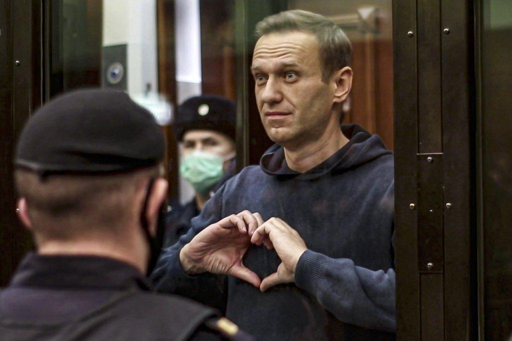 Russian opposition leader Alexei Navalny shows a heart symbol at the Moscow City Court in Moscow, Russia, Feb 2. Navalny returned to Russia in January after recuperating in Germany and was immediately arrested on allegations he violated parole. Photo: AP