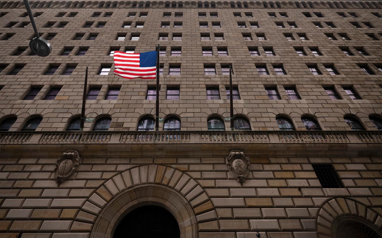 The US flag hangs on the Federal Reserve Bank of New York, Aug 4, 2020. An attempt by Myanmar's military rulers to move US$1 billion held at the bank days after seizing power was blocked by US officials. Photo: AP