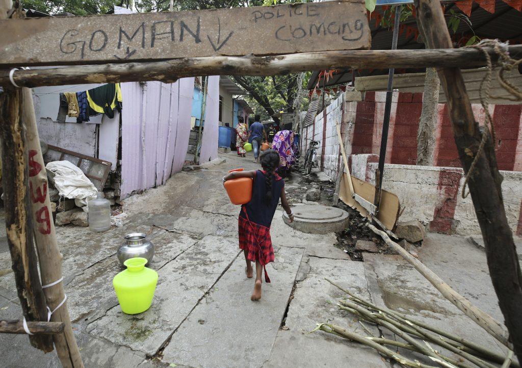 A young girl carries a jug of water in a village in India. The chief justice of India's Supreme Court is facing pressure to resign following several remarks made in a rape case involving a minor. Photo: AP