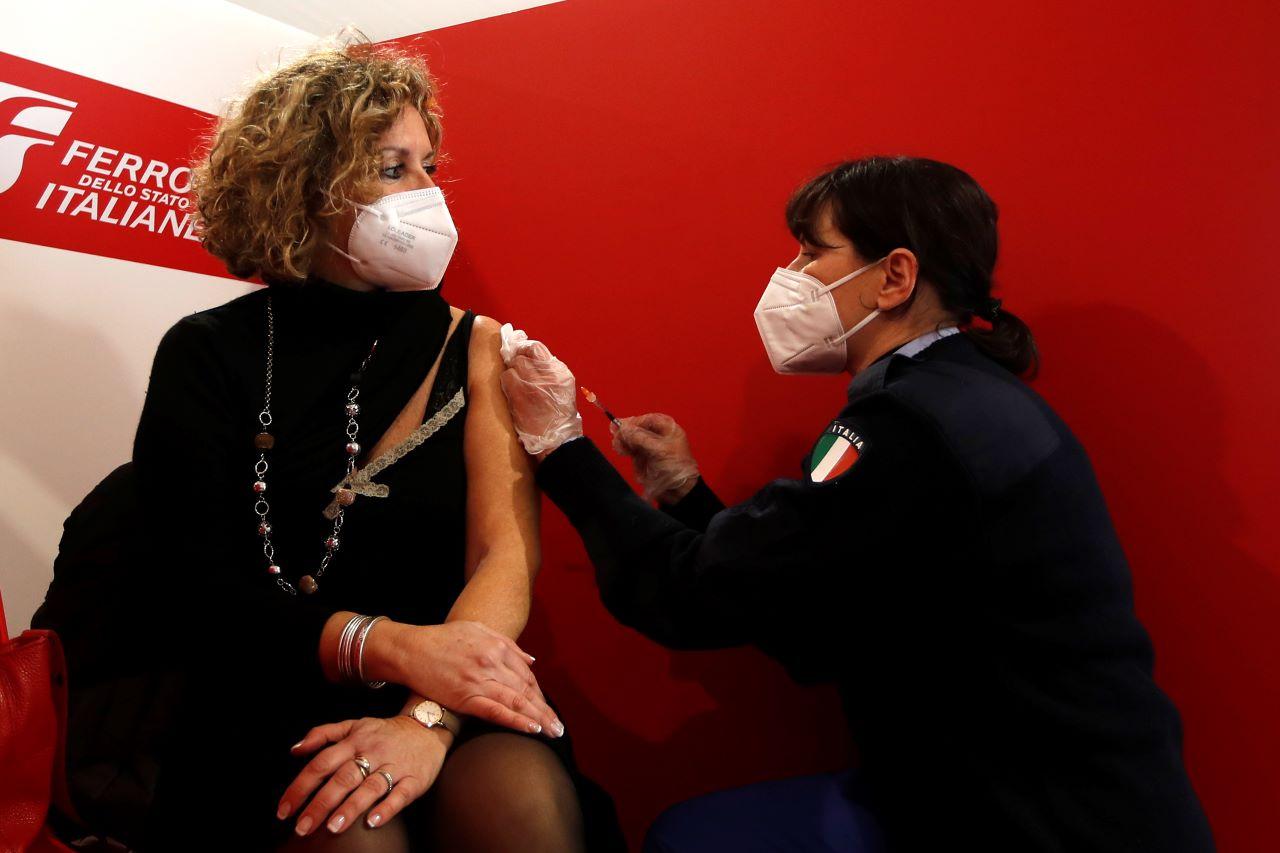 A health worker administers a dose of the AstraZeneca vaccine to a woman at a vaccination centre set up in front of Rome's Termini central station, March 8. As in many other European countries, Italy's vaccine programme has had a slow start, dogged in large part by a lack of jabs. Photo: AP