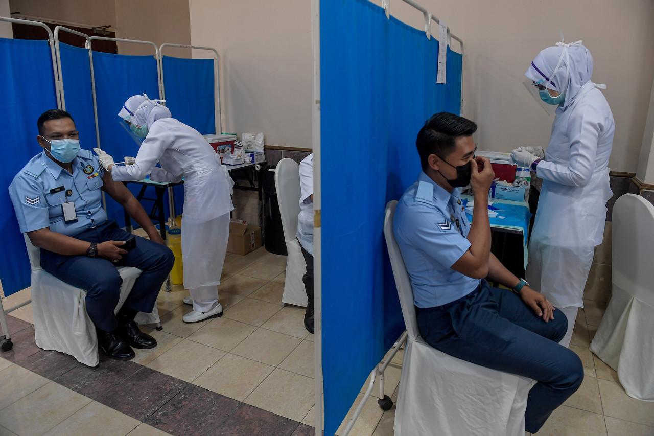 Armed forces personnel receive their first dose of the Pfizer-BioNTech vaccine under Phase 1 of the national inoculation programme at Wisma Pertahanan Kementerian Pertahanan in Kuala Lumpur today. Photo: Bernama