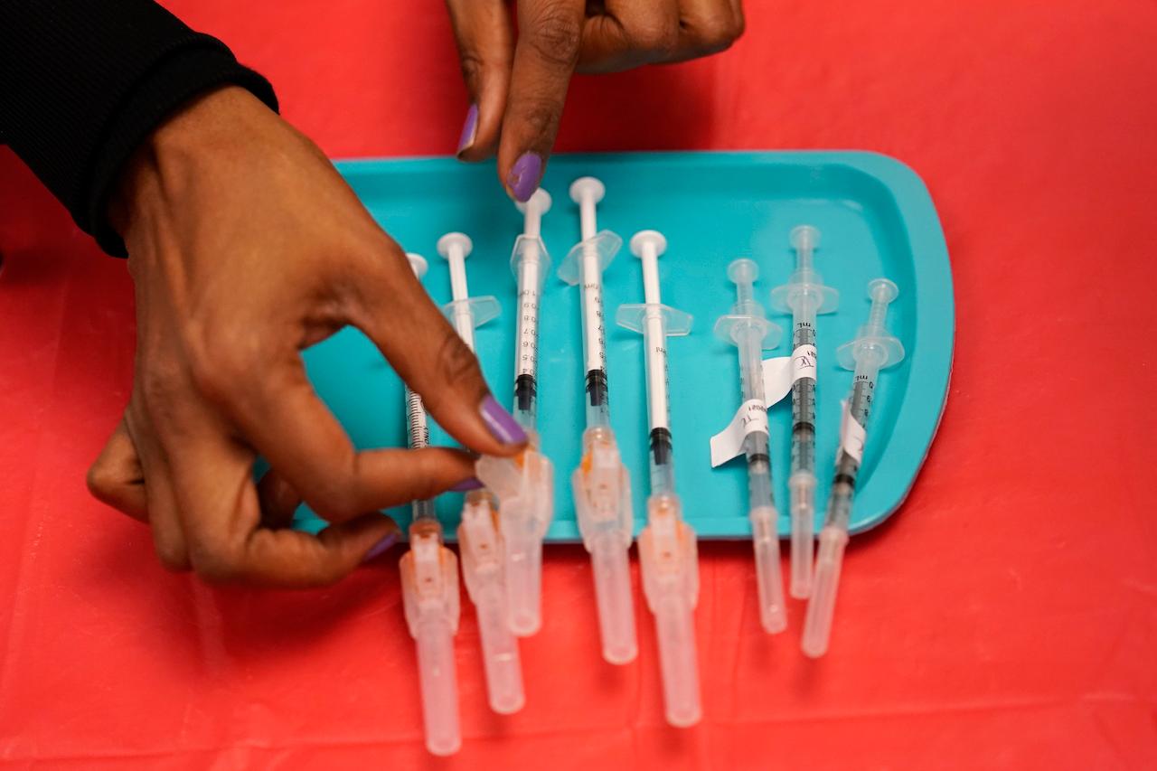 A medical assistant prepares doses of the Pfizer Covid-19 vaccine at a vaccination centre at the University of Nevada, Las Vegas. Pfizer's vaccine has been the prime target of Russian misinformation, according to a report released Monday by the Alliance for Security Democracy. Photo: AP