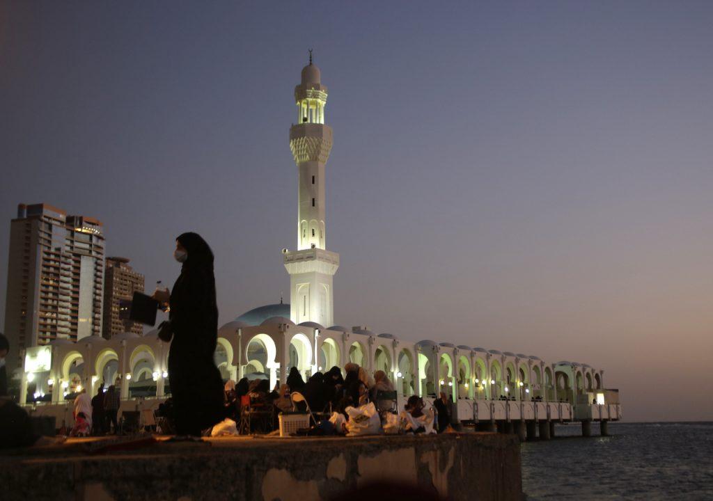 People gather at sunset in front of the al Rahma Mosque, also known as the Floating Mosque, in the Red Sea port city of Jiddah, Saudi Arabia, Jan 19. The kingdom has the Middle East’s biggest economy, is the world’s top oil exporter and the government is the driver of economic activity and the biggest spender. Photo: AP