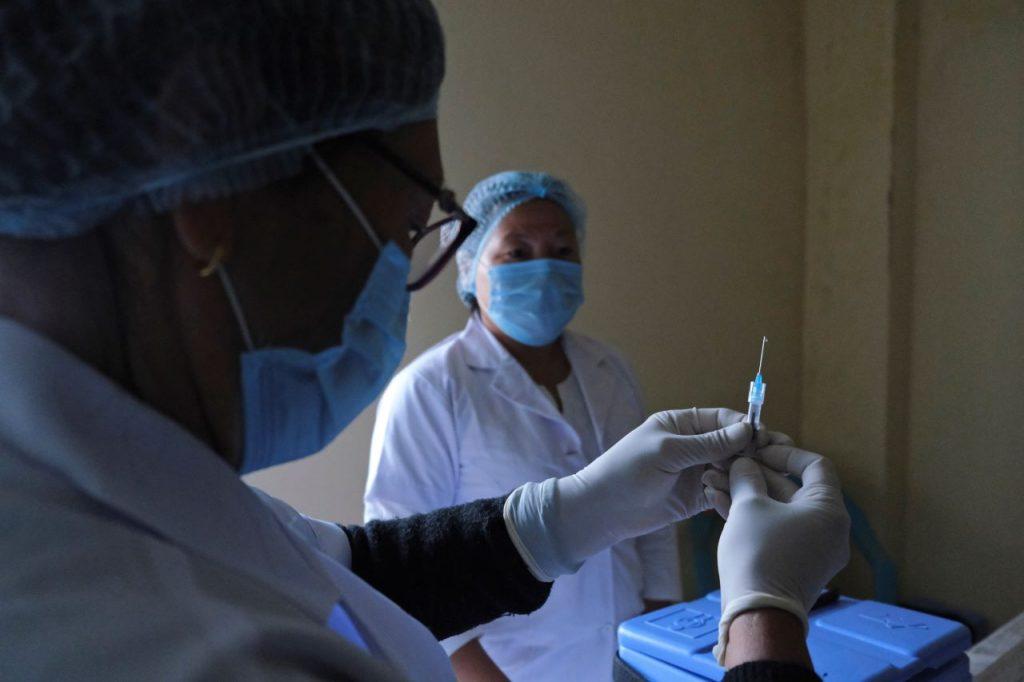 A nurse prepares a syringe with Covid-19 vaccine at District Hospital in Ukhrul, in the northeastern Indian state of Manipur, Jan 16. The Quad meeting this Friday plans to announce financing agreements to support an increase in manufacturing capacity for coronavirus vaccines in India. Photo: AP