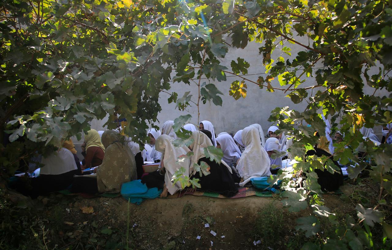 Afghan students attend an open air class at a primary school in Kabul, Afghanistan, on Oct 7, 2020. An Afghan education ministry memo banning girls over 12 from singing at public school functions, which the education ministry says was a mistake, is causing a social media stir. Photo: AP