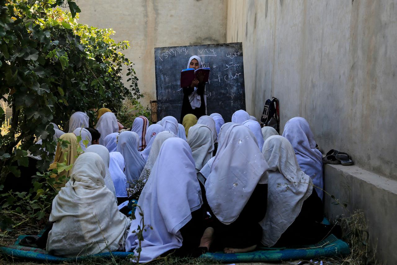 Students attend an open-air class at a primary school in Kabul, Afghanistan. Officials in the Afghan capital have reversed a ban on schoolgirls singing after a strong backlash on social media. Photo: AP