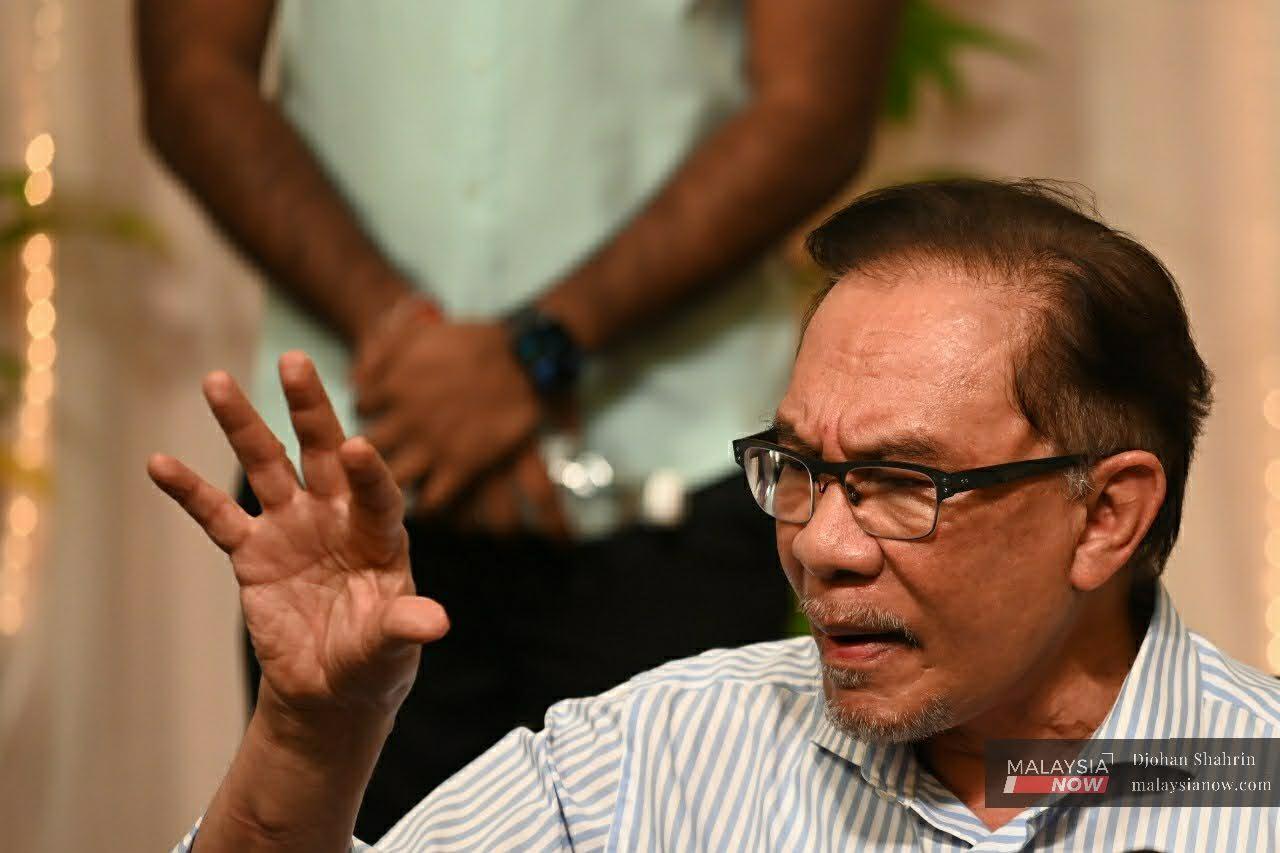 PKR leader Anwar Ibrahim speaks at a press conference in Petaling Jaya today.