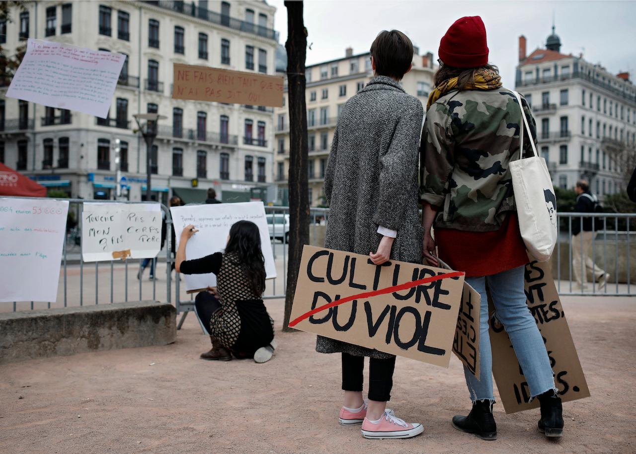 A woman holds a banner reading 'Rape Cultuer' during a demonstration in Lyon, central France, in this file photo taken Oct 29, 2017. Supporters of a new law on age of consent and incest say it will make it easier to prosecute both historical and recent cases of sexual abuse. Photo: AP
