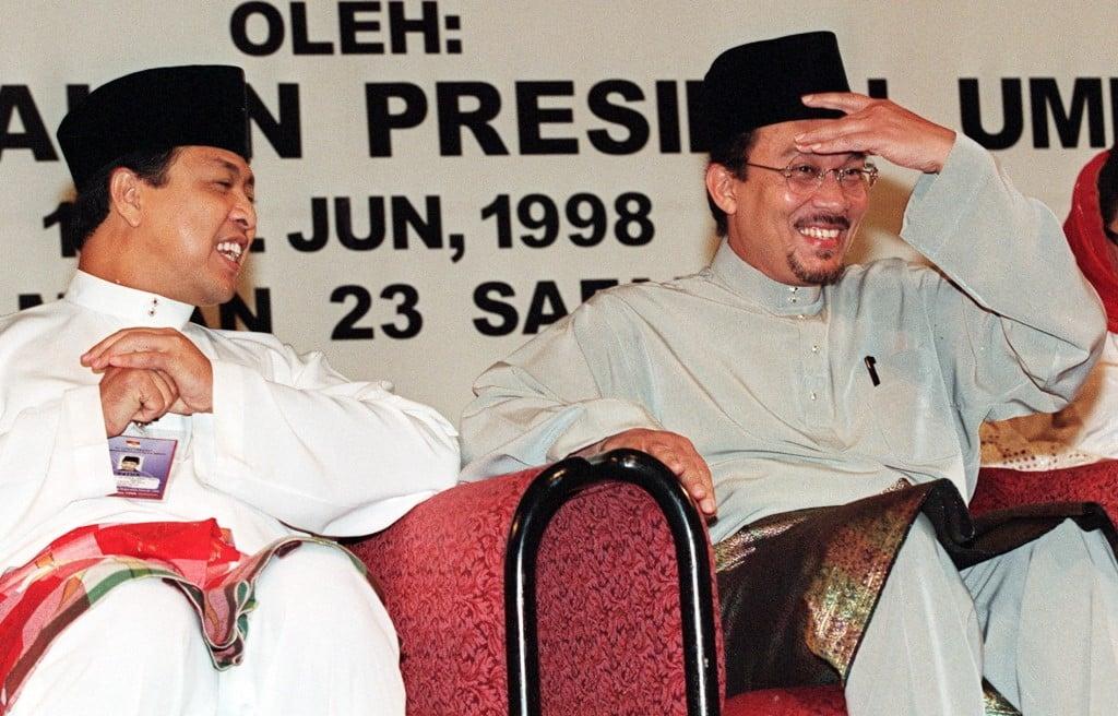 Anwar Ibrahim (right) and Ahmad Zahid Hamidi share a light moment together before an Umno event in 1998. The two have remained friends despite their subsequent political divergence. Photo: AFP
