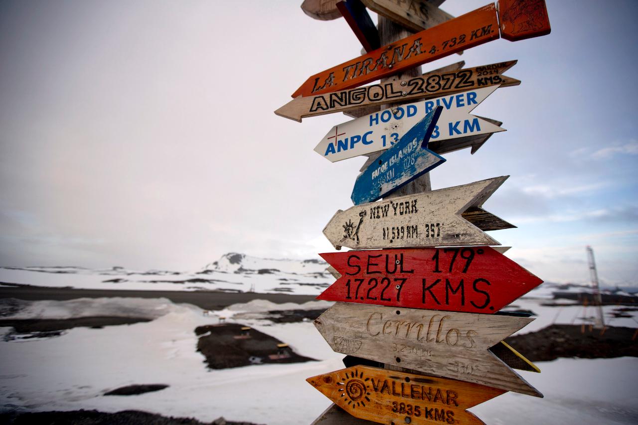 In this Jan 20, 2015 file photo, wooden arrows show the distances to various cities on King George Island, Antarctica. The pandemic hit the frozen wastes of Antarctica in December, making it the last of the world’s continents to report an outbreak of Covid-19. Photo: AP