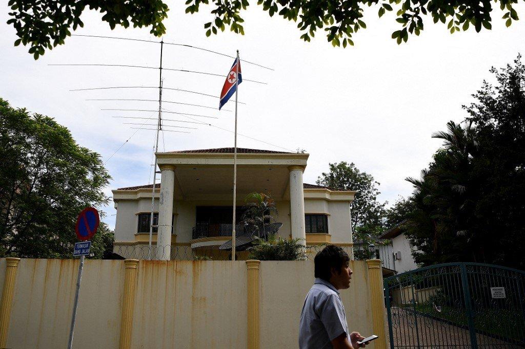 A man walks past the North Korean embassy in Kuala Lumpur, March 27, 2017. The North Korean flag was taken down today and the gates chained up as diplomats prepared to fly back to Pyongyang. Photo: AFP