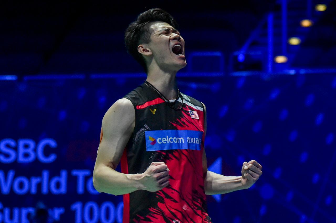 Lee Zii Jia celebrates after beating Denmark's Victor Axelsen during the men's final match of the All England Open Badminton Championships at the Utilita Arena in Birmingham, England, March 21. Photo: AP