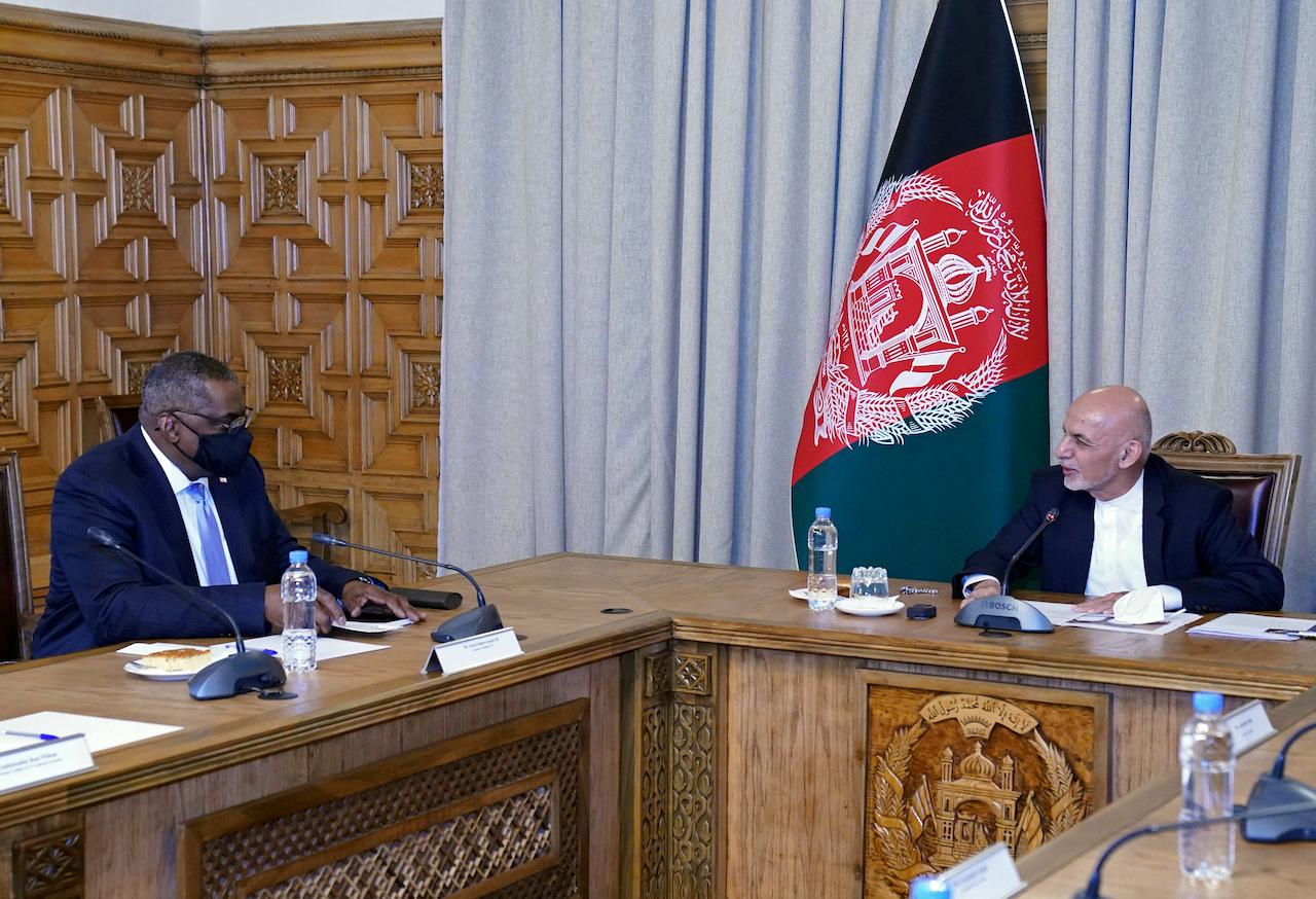 US Defence Secretary Lloyd Austin (left) meets Afgan President Ashraf Ghani at the presidential palace in Kabul, Afghanistan, March 21. Austin arrived in Kabul on his first trip to Afghanistan as Pentagon chief, amid swirling questions about how long American troops will remain in the country. Photo: AP