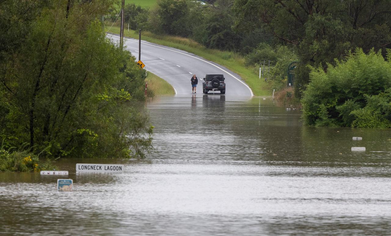 A car is blocked by a flooded river at Old Pitt Town, north west of Sydney, Australia, March 21. Australia's most populous state of New South Wales on Sunday issued more evacuation orders following the worst flooding in decades. Photo: AP