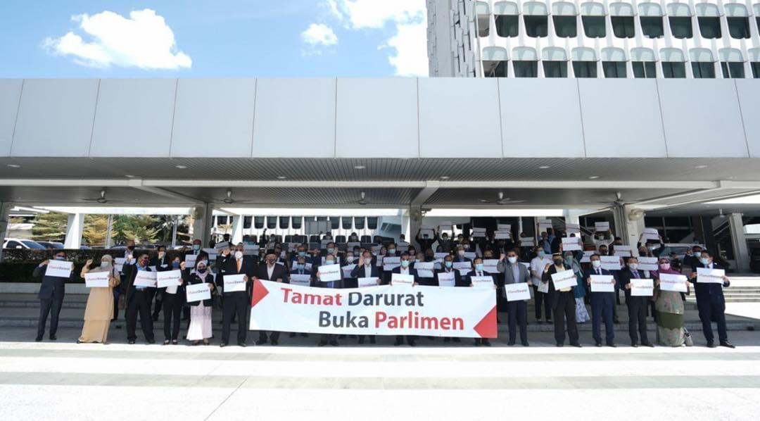 Pakatan Harapan MPs gather at the Parliament building in Kuala Lumpur today, calling for Dewan Rakyat to convene during the emergency period.